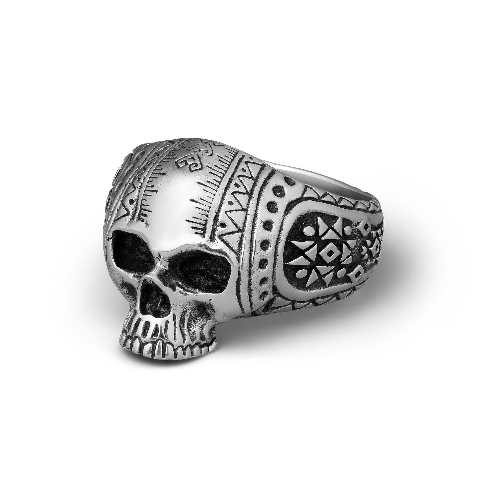 Silver skull ring with intricate patterns on a white background