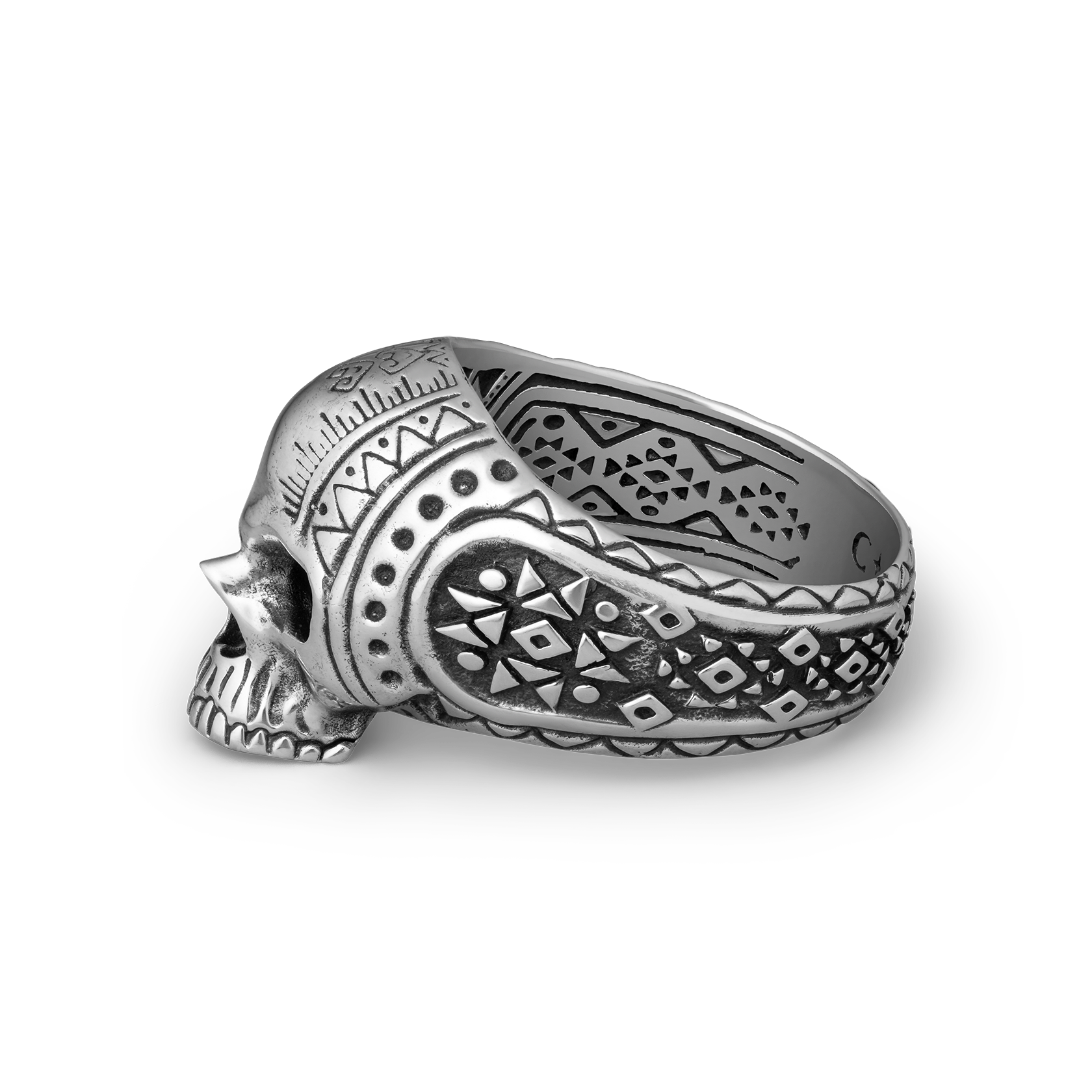 Silver skull ring with intricate patterns on a white background