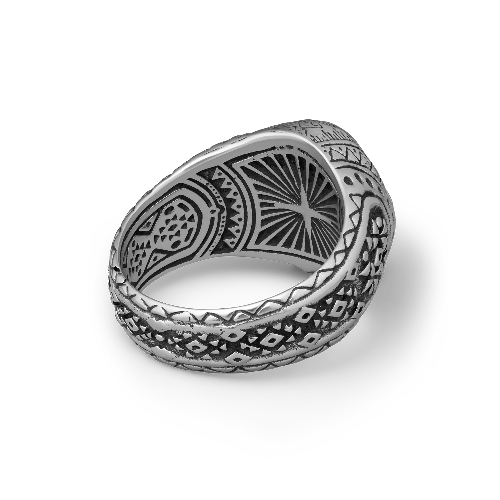 Silver ring with intricate patterns on a white background